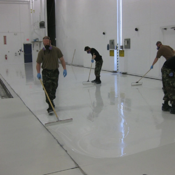 A team of IK Epoxy Paint doing their work of self leveling epoxy