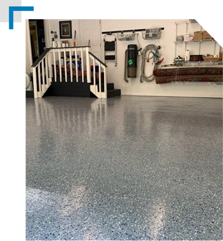 concrete epoxy garage floor with white and black decorative flakes