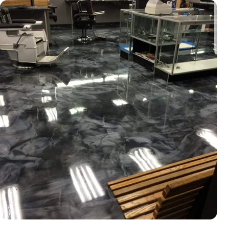 metallic black and silver marbled epoxy floor in a barbershop