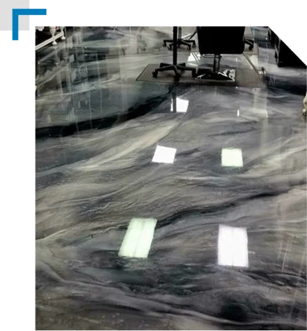 metallic black, gray, and white marbled epoxy floor in an office or retail setting