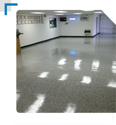shiny grey speckled epoxy floor in a brightly lit showroom